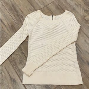 Cream sweater with zipper detail on back